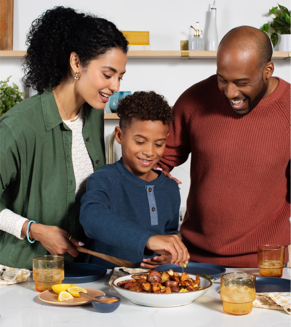 A family cooking shrimp