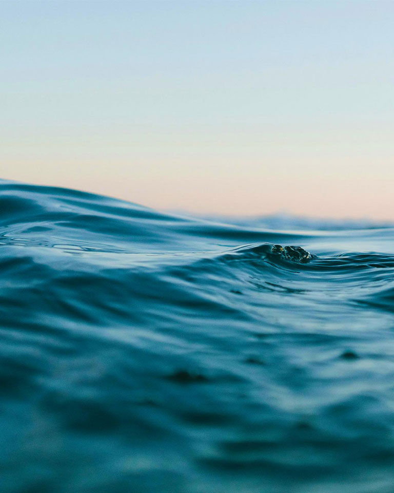 Close up of ocean waves against the sky