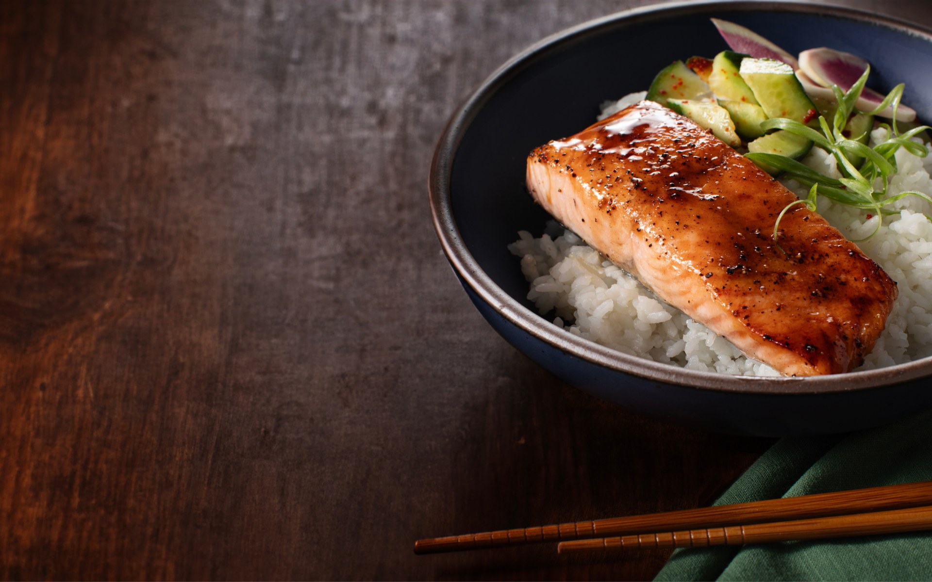 Close up of salmon in a rice bowl